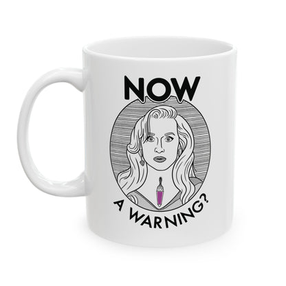 White mug with a graphic design of a woman's face and text on a white background