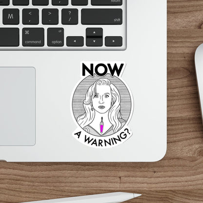 Laptop with a sticker on a wooden desk